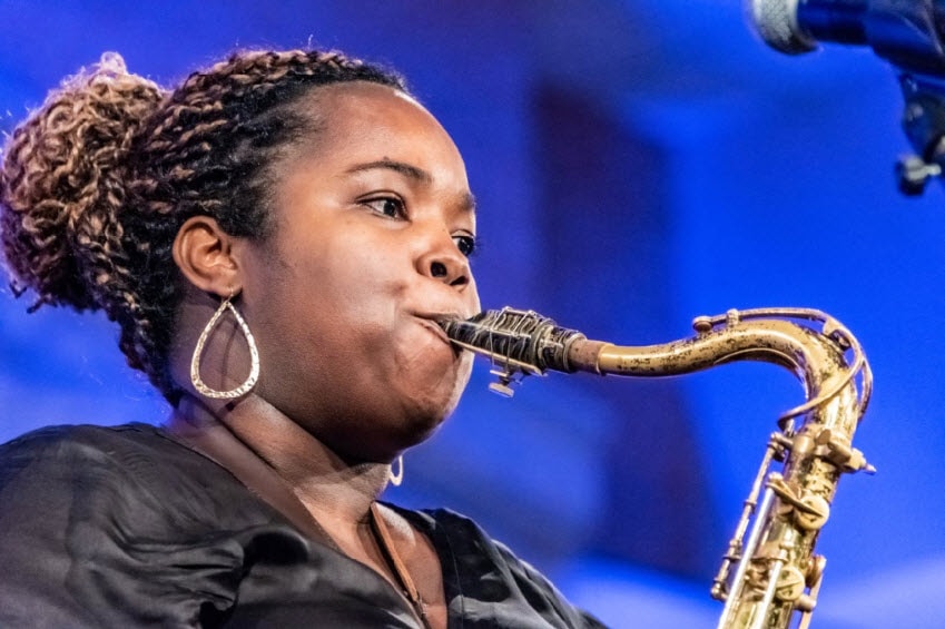 closeup of Camille Thurman playing saxophone
