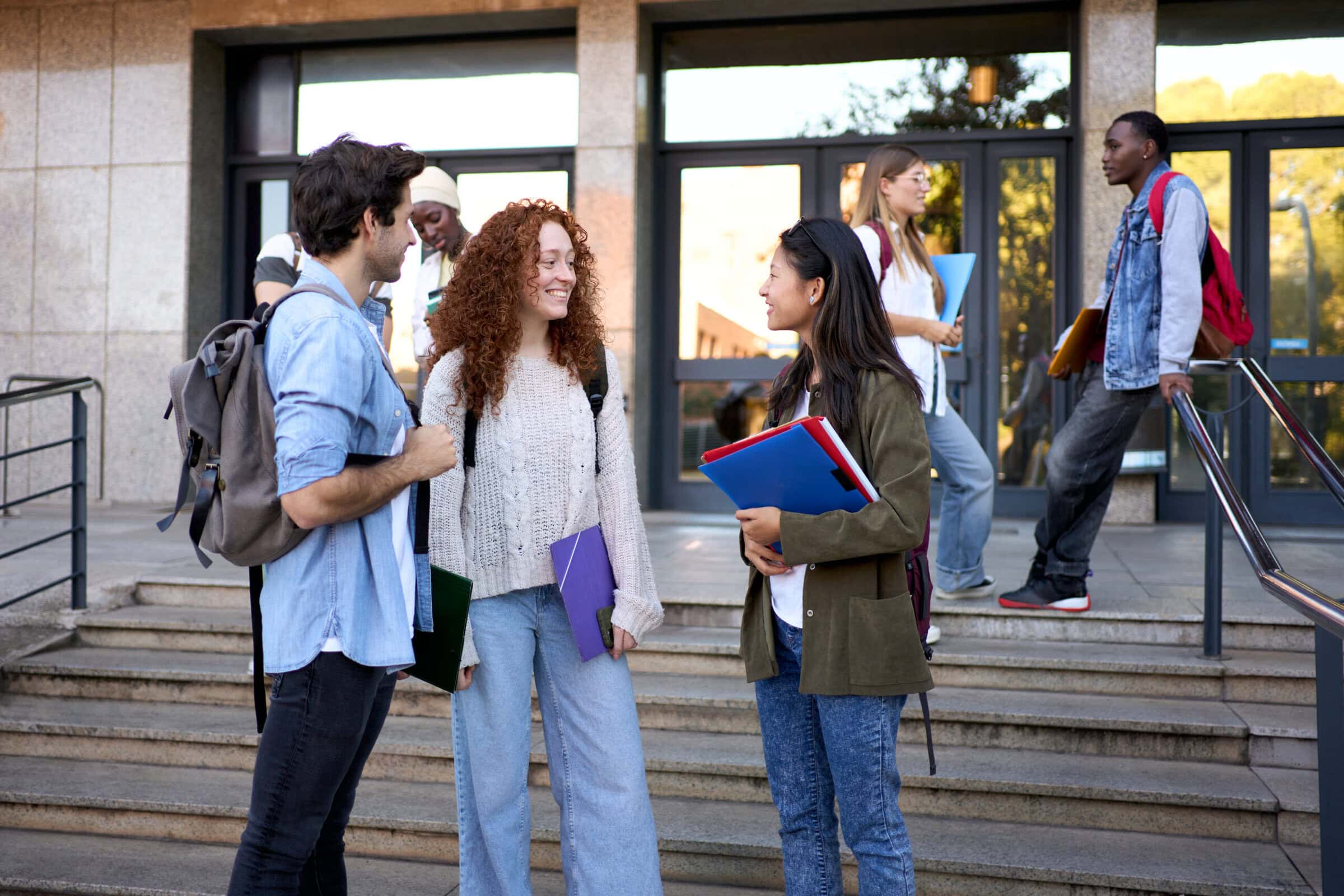 high school students outside school building