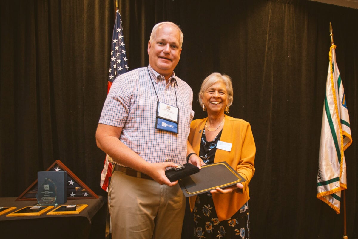 Lance Nielsen with Deb Confredo at 2024 National Leadership Assembly being presented the Lowell Mason Fellow honor